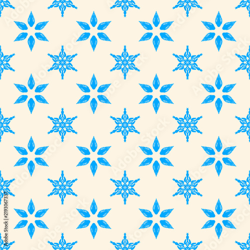 Seamless pattern with hand drawn blue snowflakes on beige background