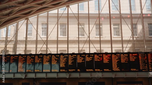 Interior of the historic King's Cross railway station in London, featuring its distinctive semi-circular lattice roof and spacious modern concourse London, England - 28 August 2026.