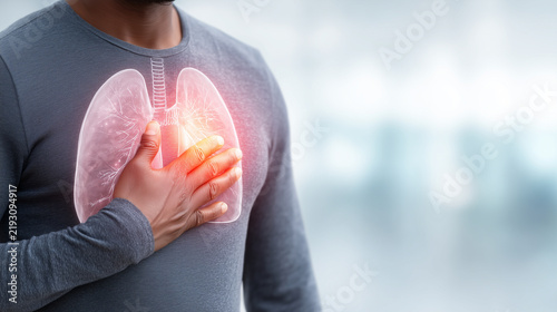 Adult person experiencing chest discomfort with a glowing anatomical lung illustration, representing respiratory health, breathing problems, pulmonary disease, medical care and healthcare awareness.