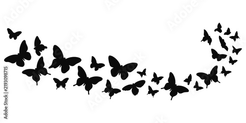 A decorative swarm of black butterflies flying in a wide curved arc isolated on a white background, featuring diverse wing shapes and sizes for a dynamic look