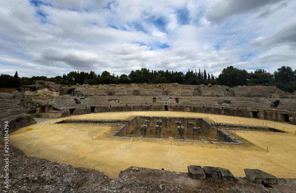 Obraz premium The arena in the amphitheater of Italica, an archaeological site at the outskirts of Seville 