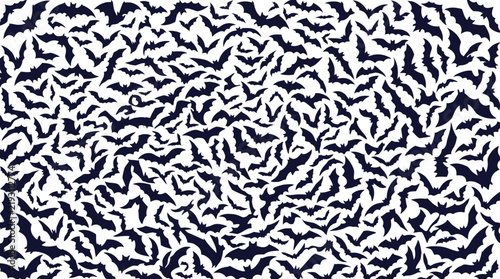 Fotografie Large swarm of bats flying in a chaotic pattern silhouette