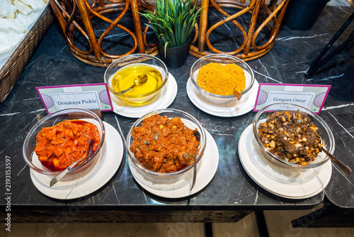 South Indian Pickles in Glass Bowls on a Buffet Counter