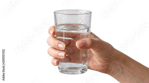 Hand holding a clear glass of fresh water with bubbles and condensation