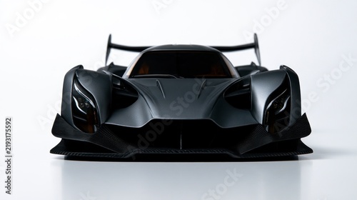 Front View of a Sleek Futuristic Dark Grey Hypercar with Aggressive Aerodynamics on a White Studio Background