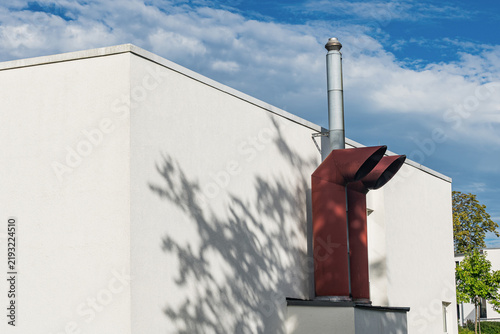 Chimney structure with shadows under a blue sky in the afternoon