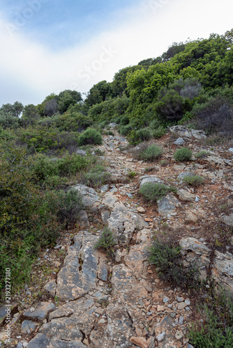 Rocky hiking trail on Kalovoulos mountain, Alonissos, Greece
