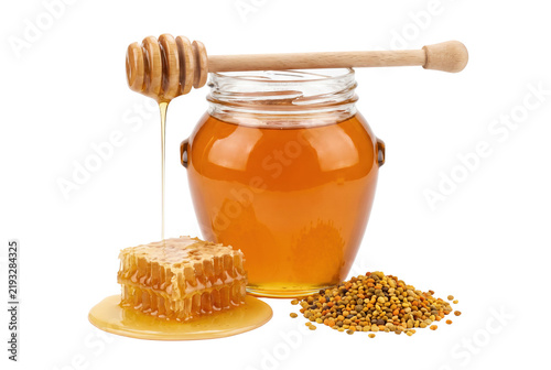 фотографія Fresh Organic Honey in Glass Jar with Honeycomb and Bee Pollen