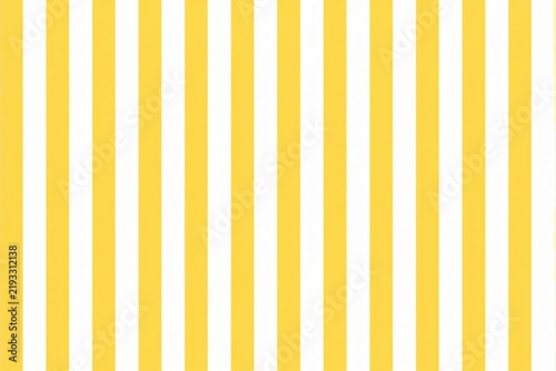 Yellow and white vertical stripes pattern on flat surface