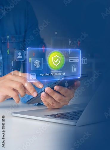 Two-factor authentication concept with Man using laptop to log in securely and verify on smartphone, symbolizing data protection, banking, money transfer, global security.