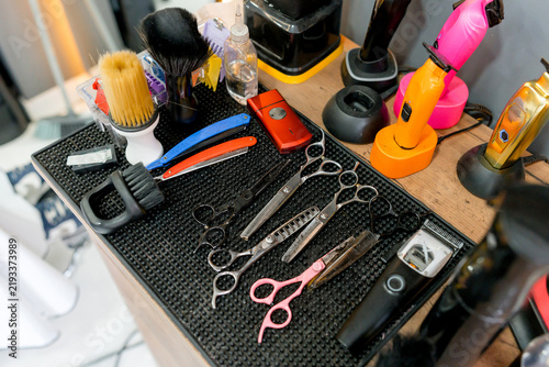 Professional barber tool collection on a barbershop workstation