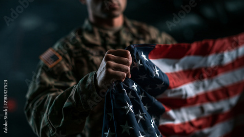 Soldier in Camouflage Uniform Holding American Flag