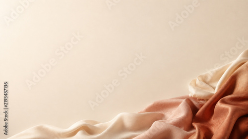 pastel fabric background with soft folds and warm tones