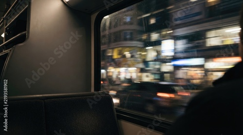 Moody Urban Commute: City Lights Viewed from Train Window