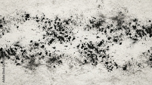 Black charcoal dust texture on textured paper background