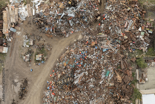 Fotografie Aerial view of piles of scrap metal and discarded industrial materials at a recycling yard