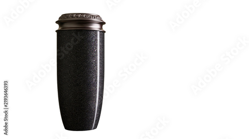 Isolated solemn dark speckled granite funerary urn with elegant ornate bronze lid.