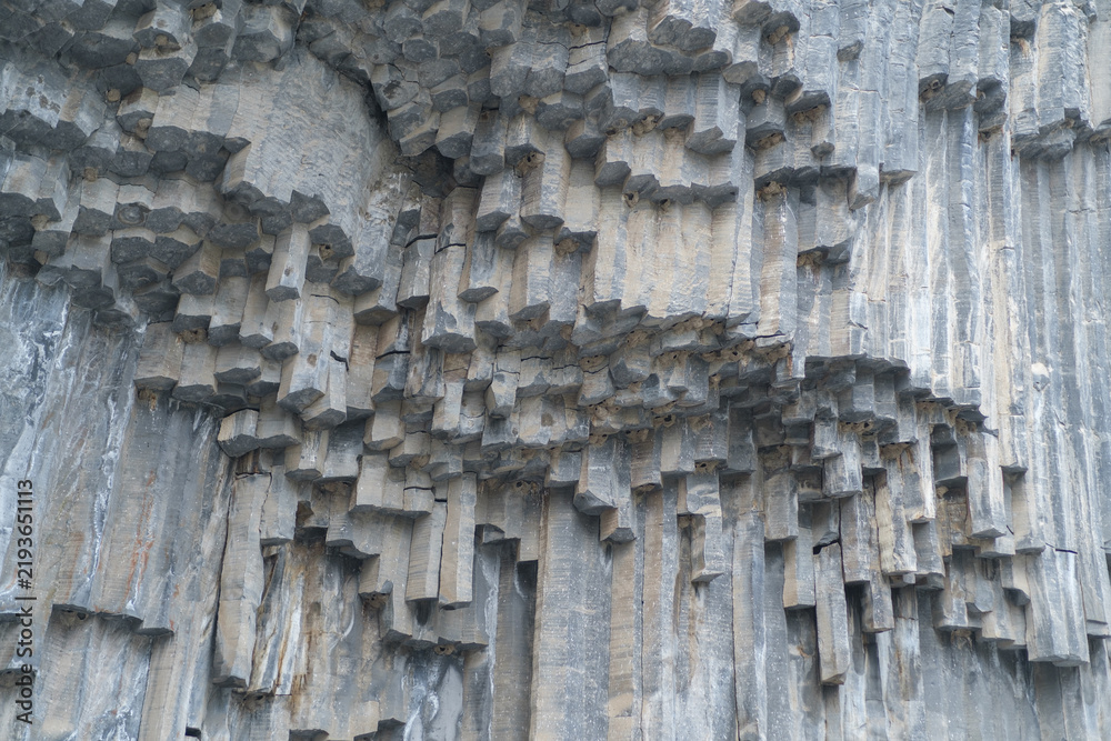 Obraz premium Geological formations of basalt columns in Armenia display unique patterns and textures, highlighting the natural beauty of stone structures in the landscape