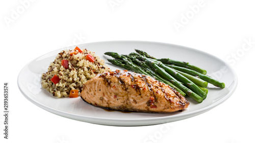 Bild auf Leinwand Isolated grilled salmon fillet with quinoa and fresh asparagus spears on a white plate