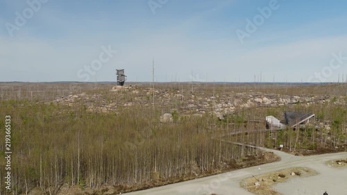 Observation tower and boardwalk across recovering burned forest landscape