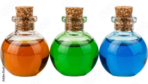 Foto Three round glass potion bottles with cork stoppers filled with orange green and
