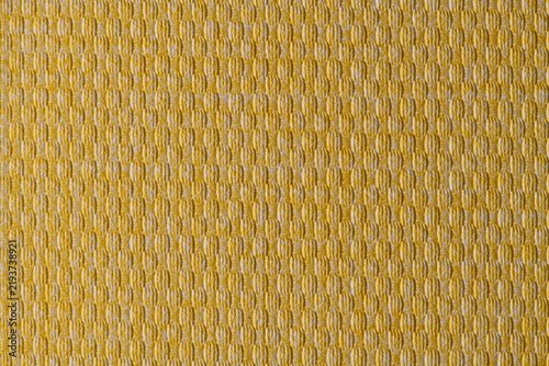 Yellow textured fabric texture background with geometric woven pattern