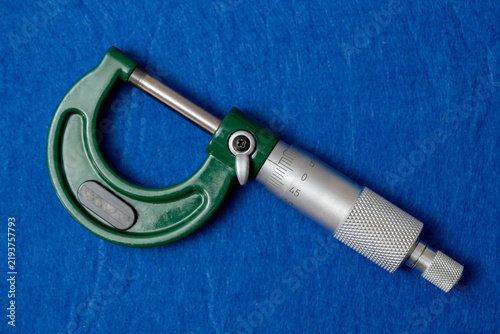 Fotografie High-precision instrument, micrometer on top of blue velvet cloth