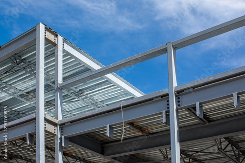 Structural steel framework building with corrugated metal decking and concrete block wall