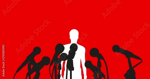 Man At Press Conference Speaking To Media With Multiple Microphones And Reporters Silhouette