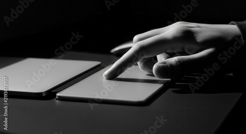 Obraz na płótnie Hand Interacting With A Trackpad Device In Dramatic Lighting