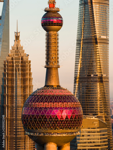 Photography Close view of skyscrapers in Shanghai CBD under a golden sunset
