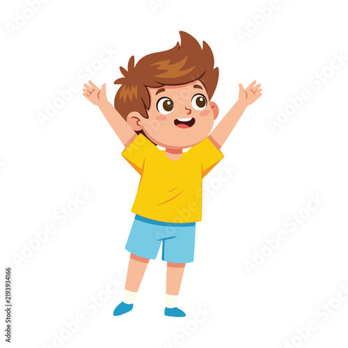 A cheerful cartoon boy with spiky brown hair, wearing a bright yellow t-shirt and blue shorts, raises both arms up in celebration.