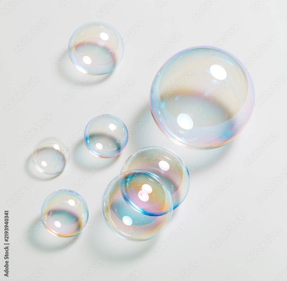 Obraz premium Colorful soap bubbles on white background