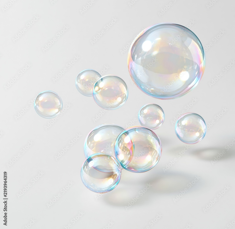 Obraz premium Colorful iridescent soap bubbles floating against white background