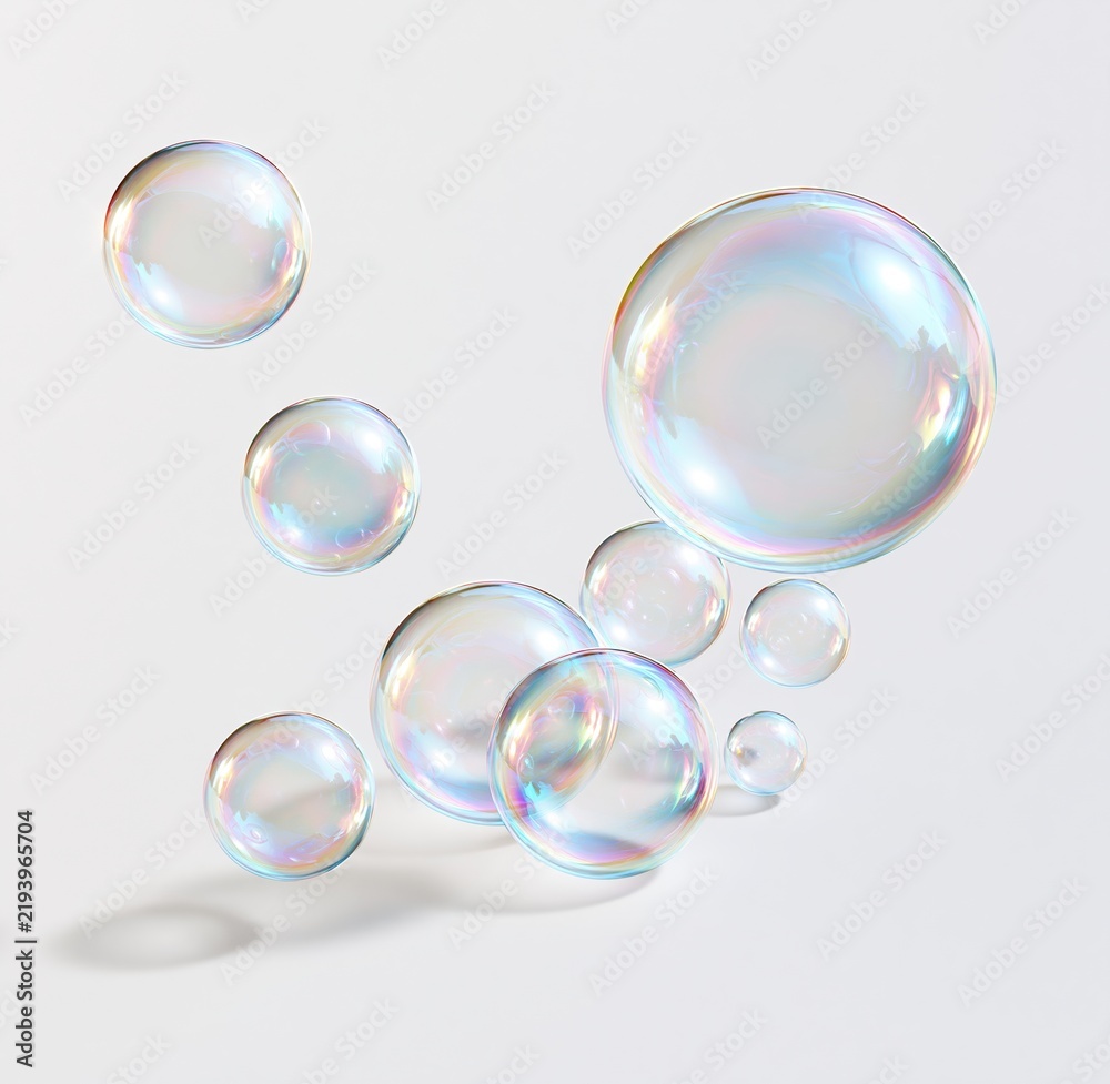 Obraz premium Colorful soap bubbles floating on white background