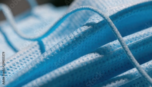 Close-up of soft blue fabric texture of a face mask