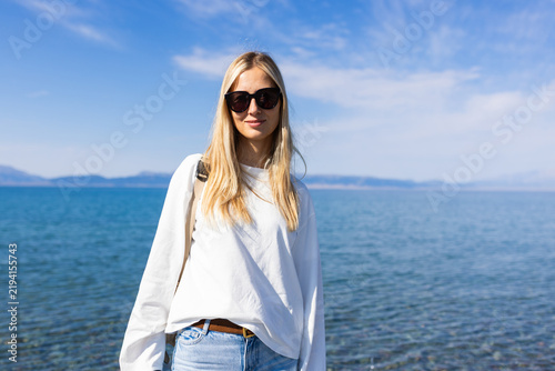 Konstfotografi Woman In Sunglasses By The Sayram lake in Xinjiang province China On A Sunny Day
