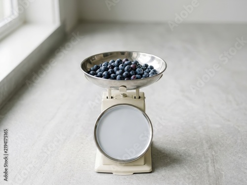 Fresh Round Berries on Kitchen Scale