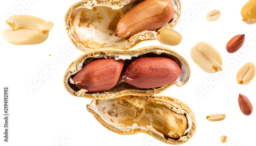 Raw Peanuts in Shells and Shelled Kernels on White Background