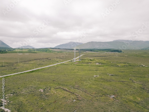 Obraz na plátně Aerial view of Lough Bofin in the Connemara region of County Galway, Ireland, surrounded by rugged mountains, green countryside and tranquil waters Galway, Ireland - 28 August 2026