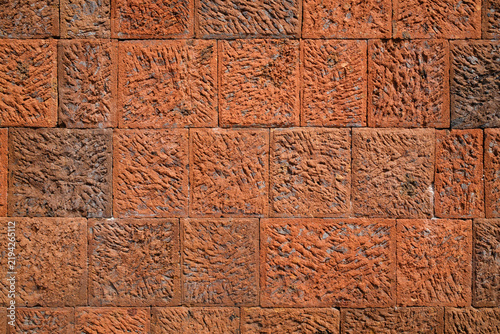 Obraz na plátně Terracotta tuff brick wall background for building exterior