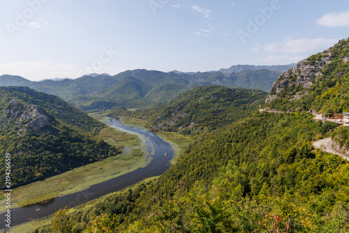 Canvas Print Winding river canyon with green mountains aerial view