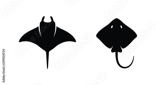 Bild auf Leinwand Two manta ray silhouettes against a white background