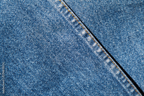 authentic original jeans texture background close up with characteristic structural joint