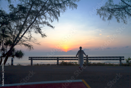 Sunrise and traveler with silhouette