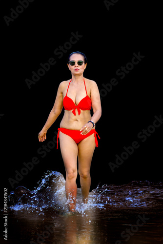 Woman in red bikini isolated