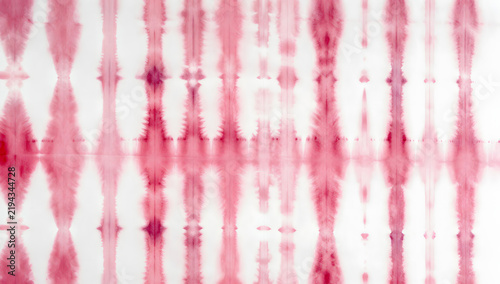 Red Tie-Dye Pattern: An abstract tie-dye pattern in shades of red and white, featuring vertical striped shapes and a soft watercolor effect, creating a unique textile design.
