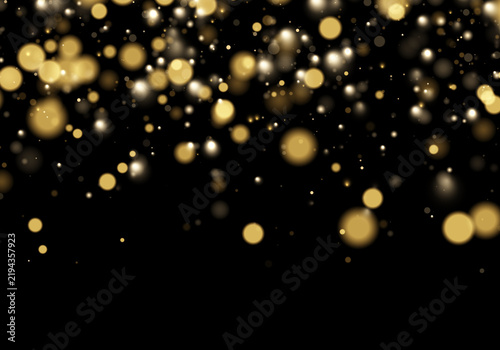 Obraz na płótnie Soft golden bokeh lights scatter across a dark background