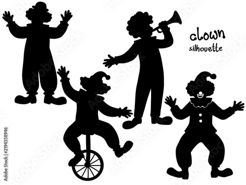 Silhouette of Clowns Performing with Musical Instrument and Unicycle