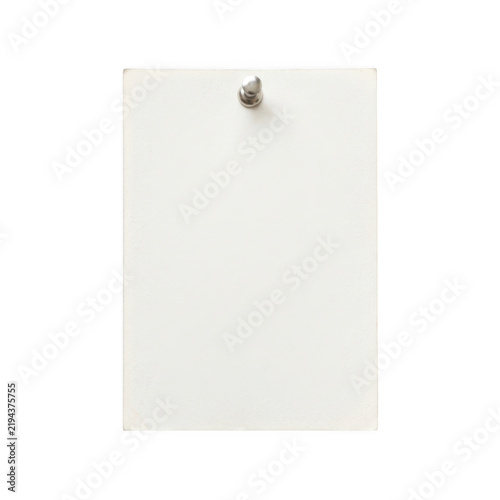 Blank white paper sheet attached with a metal push pin